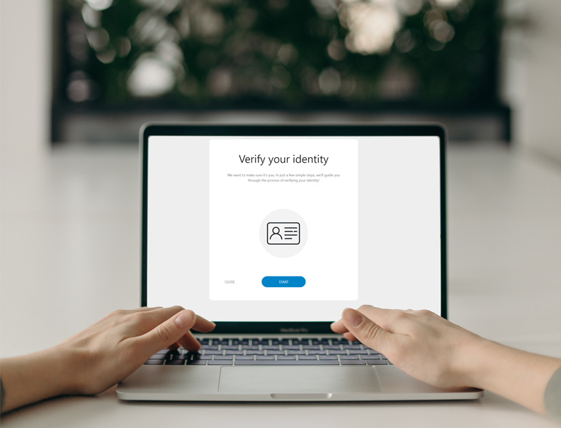 Person verifying her identity on a notebook using Verifai