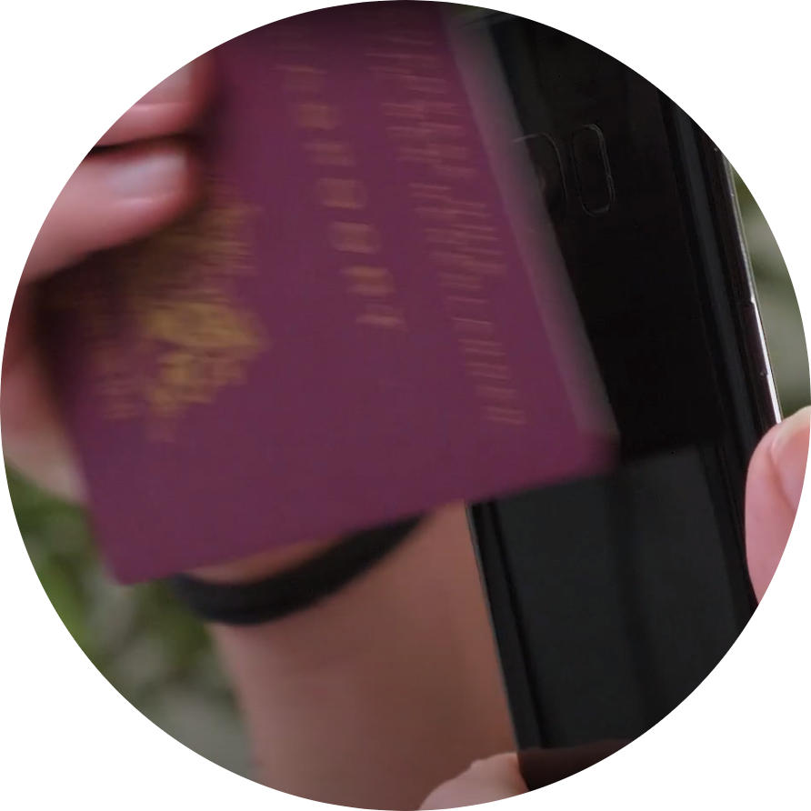 Person scanning a Dutch passport's NFC chip